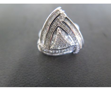 A 9ct white gold and diamond triangular mounted dress ring with baguette and round cut diamonds - approx weight 5.2 grams - r