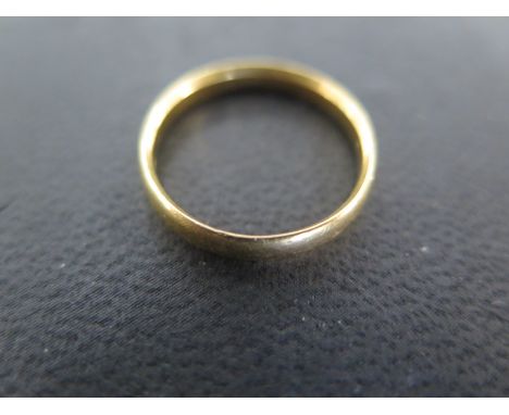 A 22ct yellow gold wedding band - approx weight 2.7 grams - ring size M/N - light surface scratches