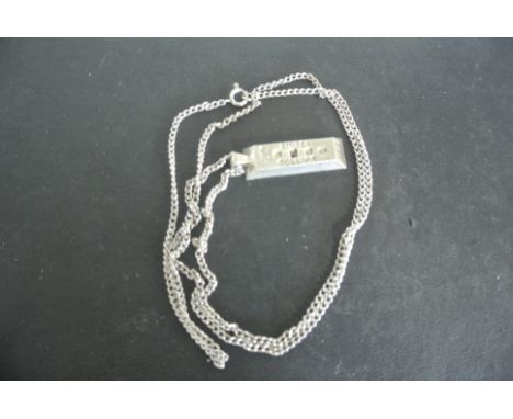 A silver ingot on silver chain approx 8 troy oz - in good condition - little dirty