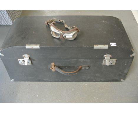 An automotive travelling trunk and a pair of driving goggles - both in good condition