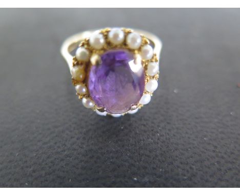 A 9ct yellow gold pearl and amethyst dress ring size S/T - approx weight 4.1 grams - some light surface scratches and usage w