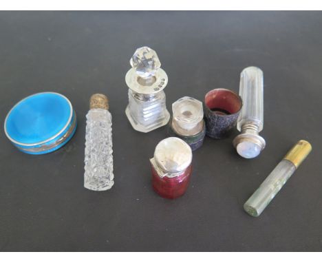 A silver and enamel compact - Diameter 5cm - damaged - and six assorted scent bottles