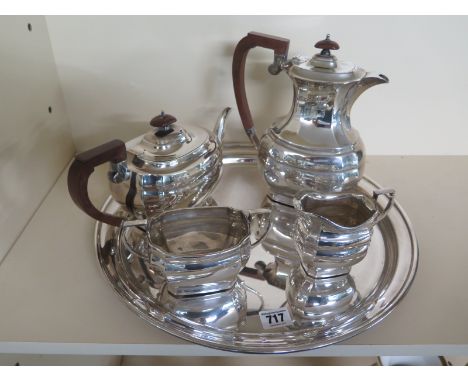 A silver plated tea service consisting tea pot, coffee pot, milk, sugar and circular serving tray