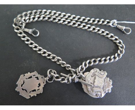A hallmarked silver Albert watch chain with T bar and silver medallions - clasp to one end damaged - approx length 48cm - app