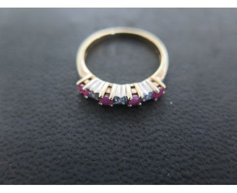 A 9ct ruby and diamond dress ring size L/M - approx weight 1.9 grams - some light usage wear