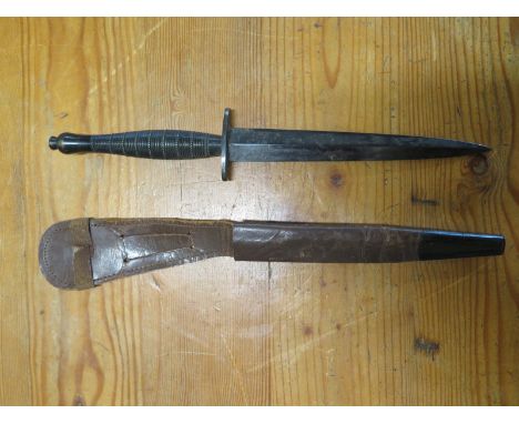 A Commando knife with scabbard - blade length 17cm, total length 30cm - no 44 stamped to grip