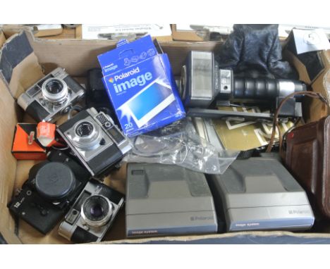 A selection of cameras, photo accessories and books, instruction manuals etc includes items by Nikon, Leitz, Robot and Polaro