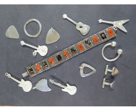 An Eastern white metal enamel marcasite bangle - Length 18cm - one stone missing and a collection of silver guitar  key ring 