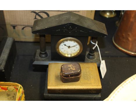 Small slate desk clock of architectural form, two Post Office savings bank money boxes of book, small inkwell (4)