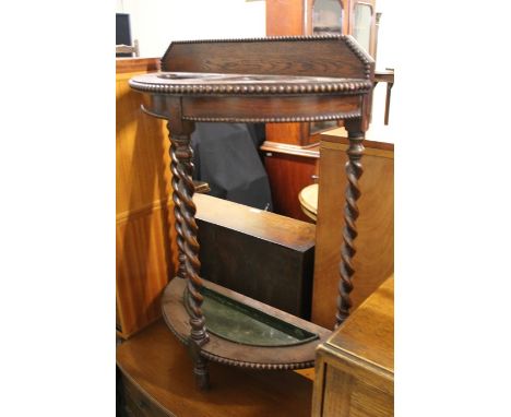 Edwardian oak stick stand with a drip tray, 58cm wide