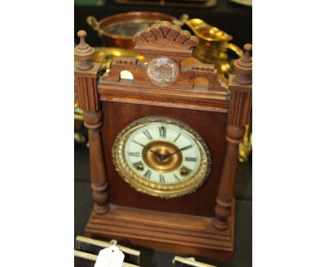Ansonia Troy mantel clock, with shell carved pediment, the ivorine dial with Roman numerals, 27cm wide