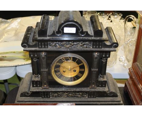 Edwardian slate mantel clock retailed by J Haskell of Ipswich, the architectural case with scrolled pediment, the ebonised di