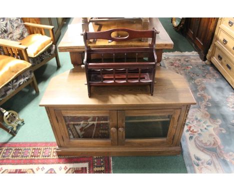 20th Century television cabinet, with two glazed doors enclosing one adjustable shelf together with a mahogany book stand (2)