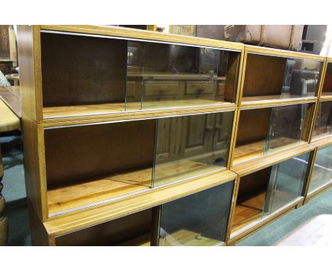 Pair of 20th Century Globe Wernicke style mahogany bookcases, the three-tier sections with glass sliding doors, 89cm high wid