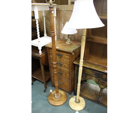 Two floor lamps, together with an onyx table lamp, the tallest 153cm high (3)