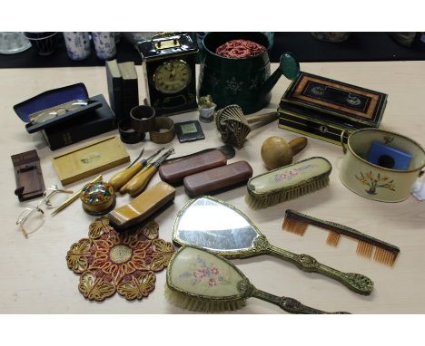 Works of art, to include cash tin, treen box with lid depicting the Laxey wheel Isle of Man, dressing table set, mantle clock