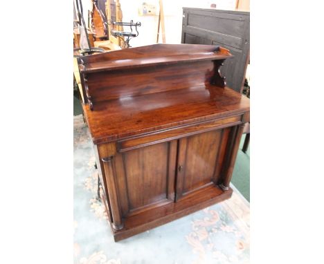 Victorian mahogany chiffonier, the point arched back with open shelf, above a cushion moulded frieze drawer above two rectang