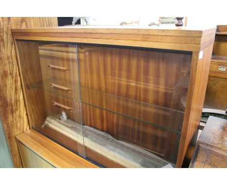 Basil Sharland display cabinet, with two glass sliding doors, opening to reveal a single glass shelf, with metal supports bel