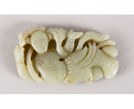 A GOOD 19TH / 20TH CENTURY CHINESE CARVED CELADON JADE PENDANT OF A GODDESS, the goddess recumbent amongst flora, 6cm.