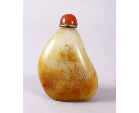 A CHINESE CARVED JADE PEBBLE SNUFF BOTTLE, with trace gilt decoration of landscapes, 8cm
