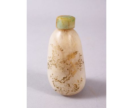 A CHINESE CARVED JADE SNUFF BOTTLE, with trace gilt decoration of birds and flora, 7.5cm high