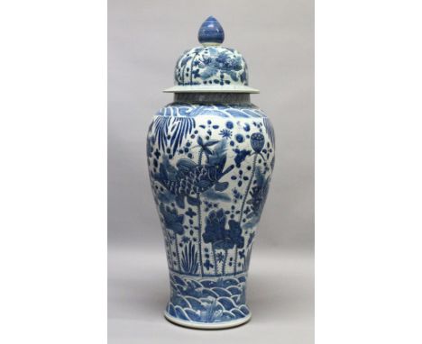 A LARGE 20TH CENTURY KANGXI STYLE BLUE AND WHITE FLOOR STANDING VASE AND COVER, the body painted with scenes of fish, water l