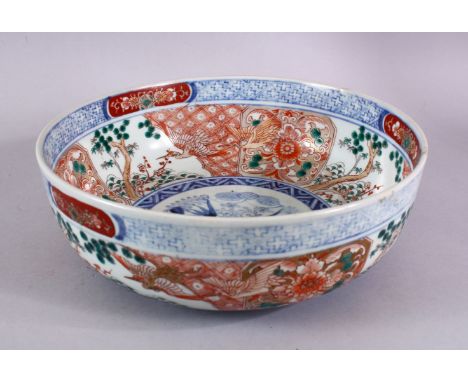 A GOOD JAPANESE MEIJI PERIOD PORCELAIN IMARI BOWL, with underglaze blue decoration of twin ho ho birds, amongst enamel decora