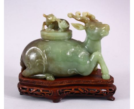 A CHINESE CARVED JADE DEER CENSER &amp; COVER, The deer in a recumbent position, with carved floral decoration, the cover wit
