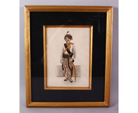 AN INDIAN SCHOOL PORTRAIT MUGHAL MINIATURE OF A SOLDIER, stood in his outfit bearing his arms and badges, framed 37.5cm x 31c
