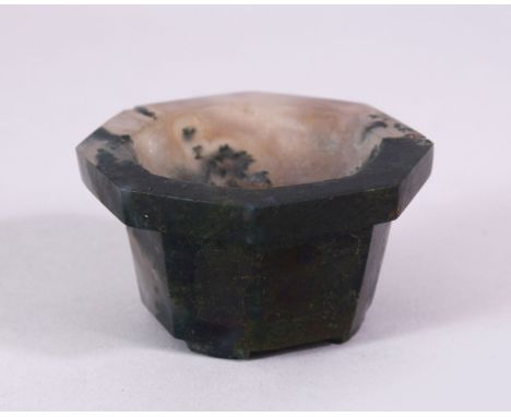 A 19TH CENTURY CHINESE OCTAGONAL JADE BRUSH WASHER, on bracket feet, 7cm diameter.