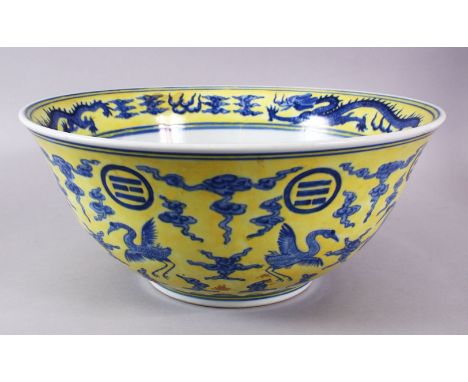 A LARGE CHINESE YELLOW &amp; BLUE PORCELAIN DRAGON BASIN, with a yellow wash ground with a central  roundel of dragon amongst