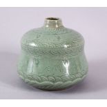 A KOREAN CELADON GOURS SHAPED CRANE / PHOENIX VASE, with moulded wave decoration with phoenix