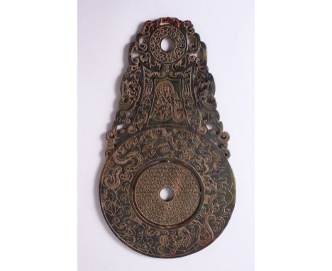 A CHINESE CARVED JADE BI DISK, carved with archaic style bats and chilong, 29cm x 16.5cm