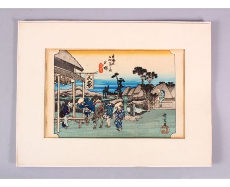A JAPANESE WOODBLOCK PRINT - FIGURES AND HORSE - the figures stood in a windswept landscape with a horse, signed and sealed, 