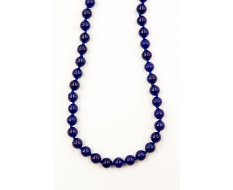 A Blue Jade single strand necklace, fitted with approx 50 round 8mm beads, with a loop clasp, 43cm / 17 inches long