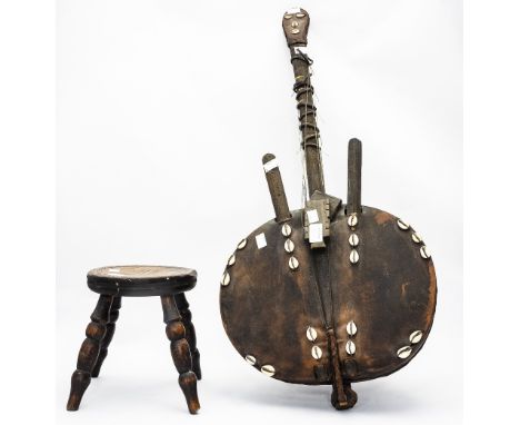 Native Art Interest, a stringed instrument, having hide covered bowl and shell decoration with a four leg stool (2) 