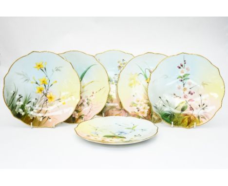 A set of six Royal Worcester floral dessert plates, 1905, each painted with wild flower specimens, ogee point rims highlighte
