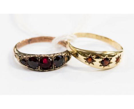 Two 9ct gold rings, one set with garnets, the other with red stones (af),ring sizes V 1/2 and R, total gross weight approxima