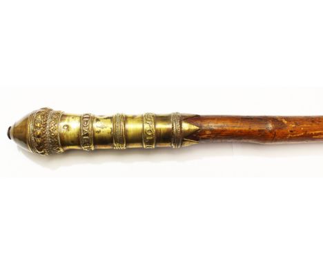 A Brass topped Tipstaff marked "Village Police Lathlehaukidar", late 19th/early 20th Century. Overall length 159cm.