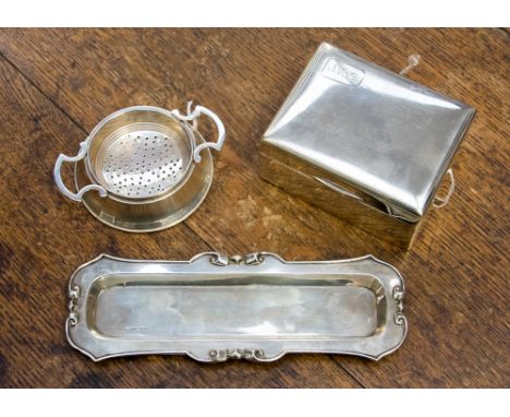 A George V silver cigarette box, Walker & Hall, Sheffield 1931; an Edwardian silver pen tray, Robert Pringle & Sons, London 1