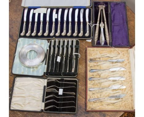 A cased set of six continental silver 800 cake knives and forks, 9.55ozt; a cased set of twelve silver handled knives; a case