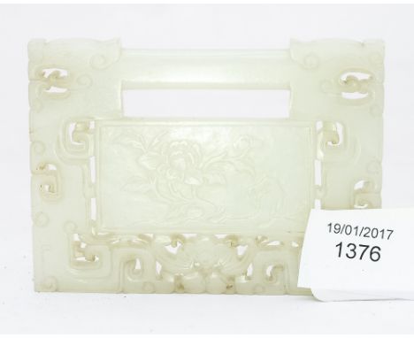 A Chinese carved jade lock pendant buckle, reticulated, rectangular plaque form, the central cartouche carved with peony on a