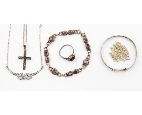 An amethyst and silver bracelet, a silver necklace, a child's bangle, a silver cross and chain and a silver and garnet ring, 