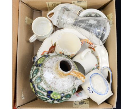An ammonite fossil polished in fossil bedrock, a German jug with lava detail, Mason's Ironstone Mandalay dish, a 2006 FIFA Wo