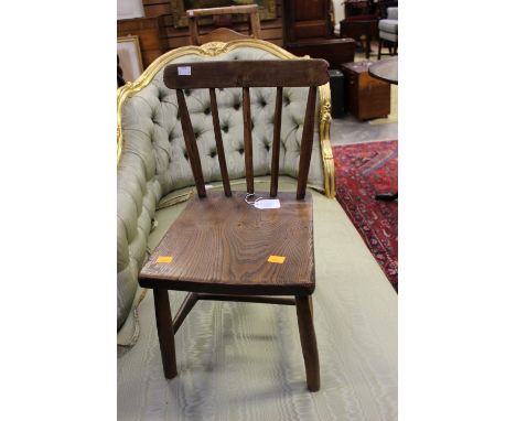 A 19th Century elm and beech child's Windsor comb-back chair, with an elm seat