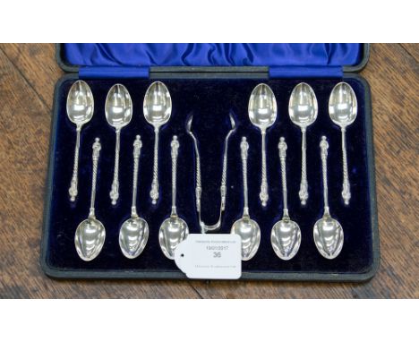 A boxed thirteen piece silver apostle tea spoon set, maker Stokes & Ireland Ltd, hallmark Chester 1906, approx 171 gms