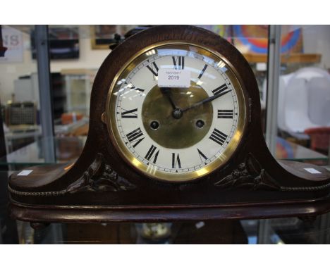 An early 20th Century oak Napoleon hat mantel clock 