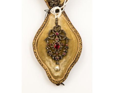 A Victorian, garland style, red spinel and baroque pearl drop pendant in original fitted leather box. Baroque pearl drop appr