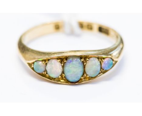 An 18ct gold opal five stone ring, 3.3 grams approx, size K 