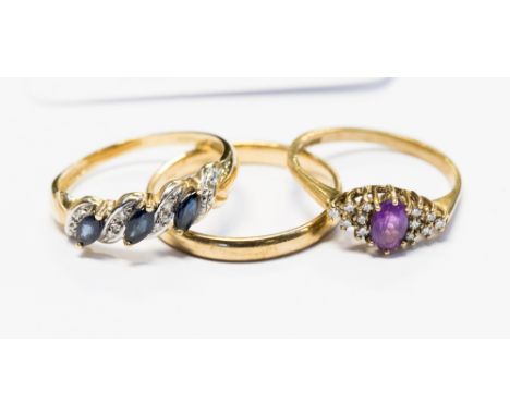 A 9ct gold wedding band, weighing approx 2.3 grams, ring size T½; with a 9ct gold ring set with amethyst and diamond chips to